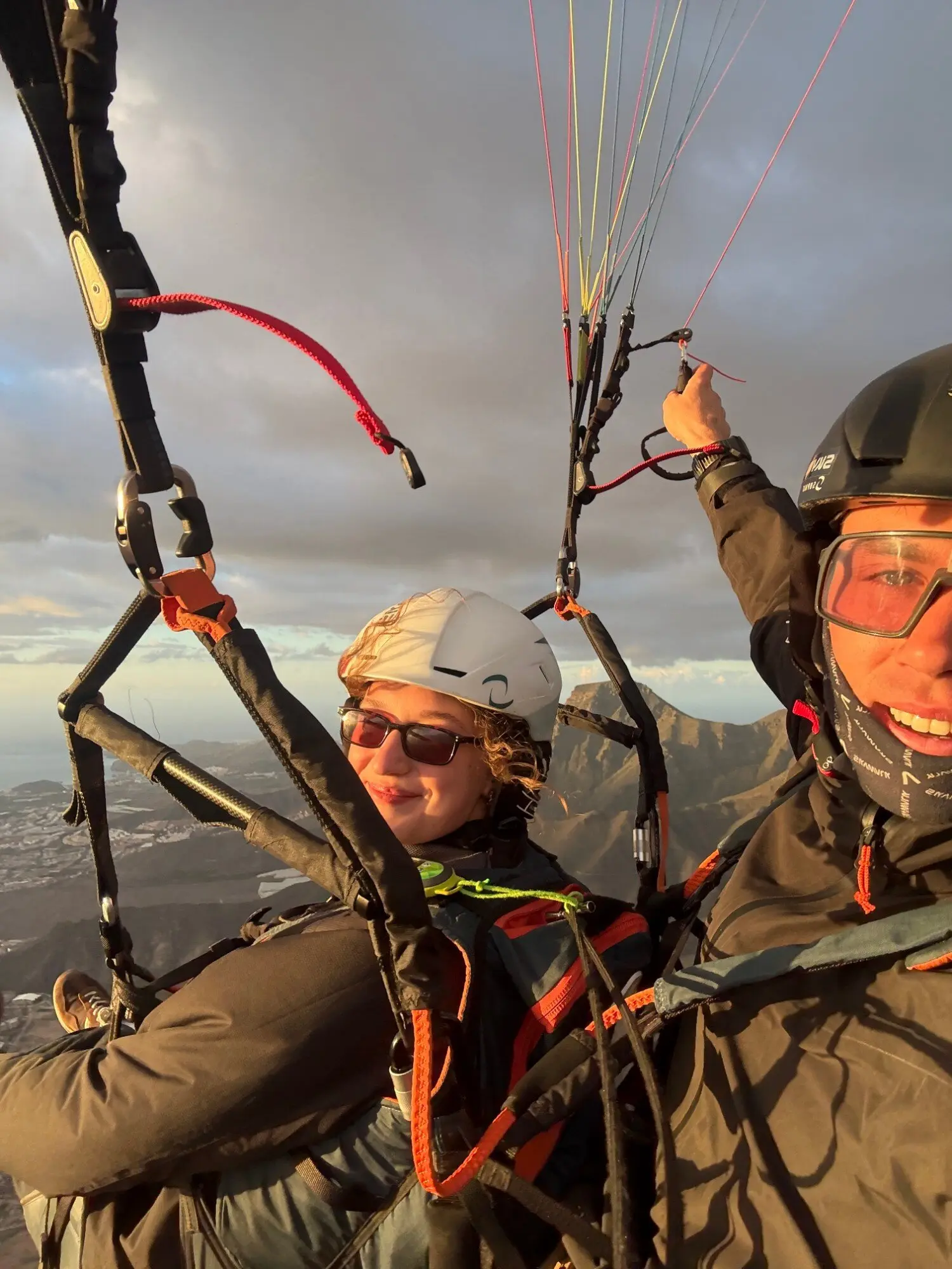 Pilot and passenger selfie at golden hour with the mountains of Adeje behind